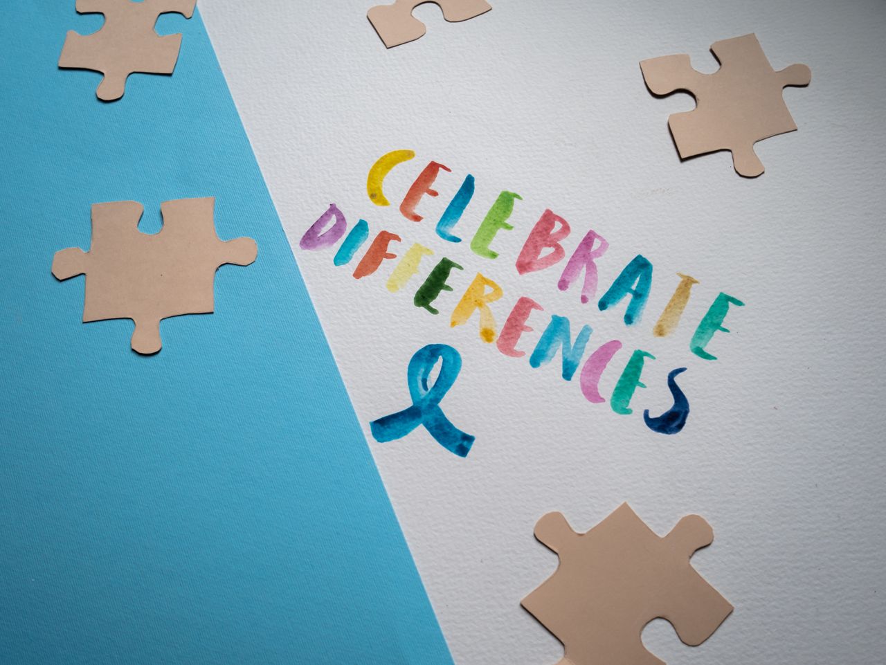 ours-journey Colorful typography and puzzle pieces celebrate diversity and uniqueness.